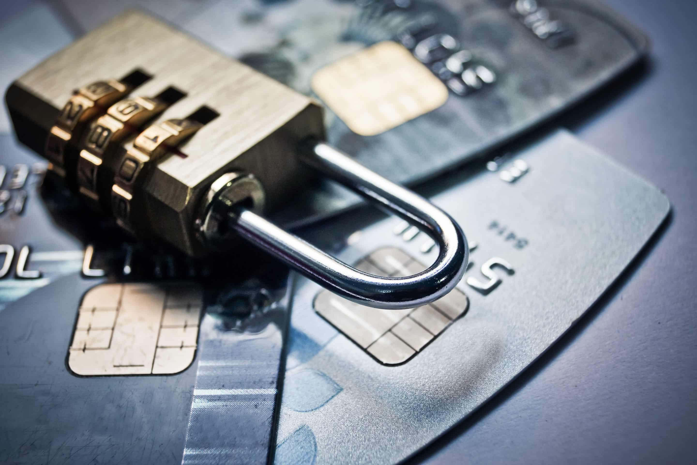 data security compliance services - image of a lock on top of credit cards